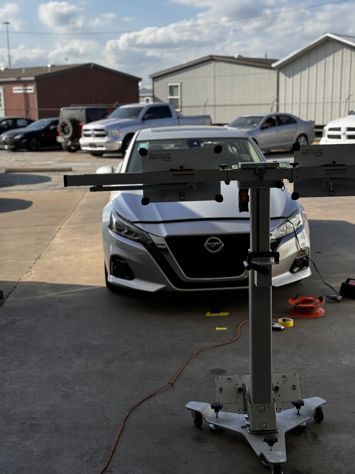 Calibration equipment set up inside a Houston collision repair bay